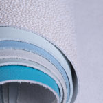 Leather swatches rolled together to display different colors